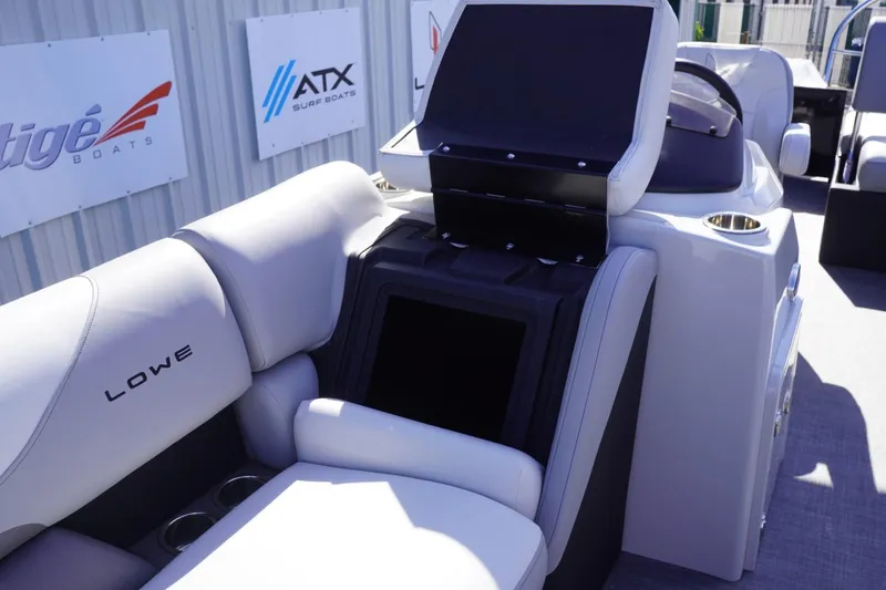 Slide: The Image of 2025 Lowe SS 230 DL boat interior with seating and storage compartment. - 46