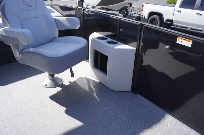 Slide: The Image of Captain's chair and console on 2025 Lowe SS 230 DL pontoon boat. - 47