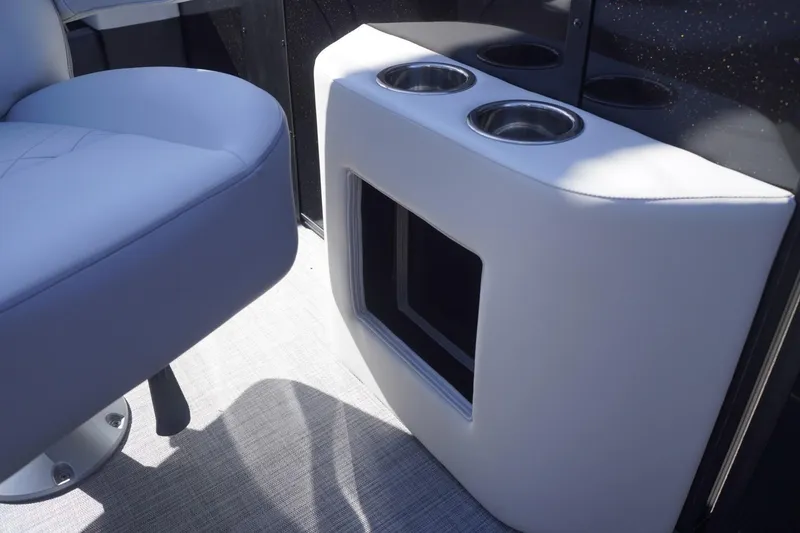 Slide: The Image of 2025 Lowe SS 230 DL boat interior with cup holders and seating. - 48