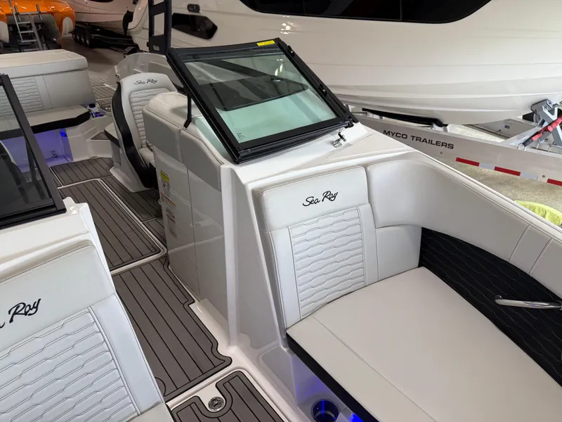 Slide: The Image of 2024 Sea Ray SPX230 boat interior with sleek seating and modern design. - 14
