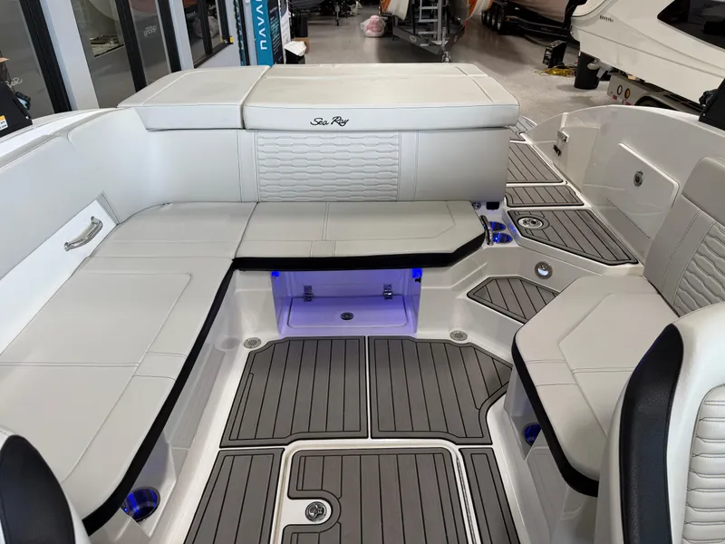Slide: The Image of 2024 Sea Ray SPX230 boat interior with sleek seating and modern design. - 17