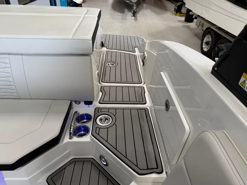 Slide: The Image of 2024 Sea Ray SPX230 boat interior with sleek seating and modern deck design. - 20