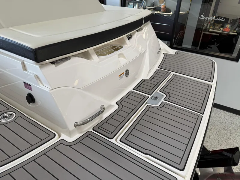 Slide: The Image of 2024 Sea Ray SPX230 boat with sleek deck design and modern features. - 25
