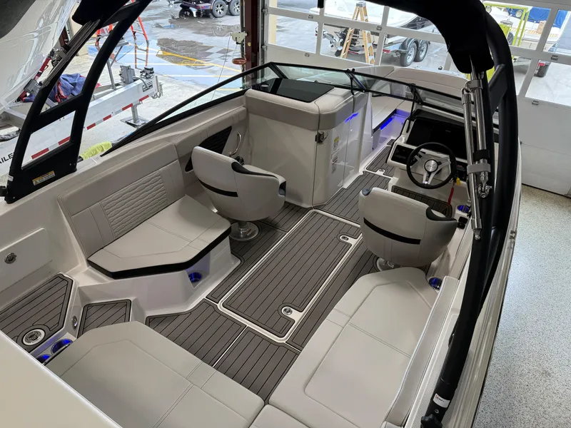 Slide: The Image of 2024 Sea Ray SPX230 boat interior with modern seating and sleek design. - 27