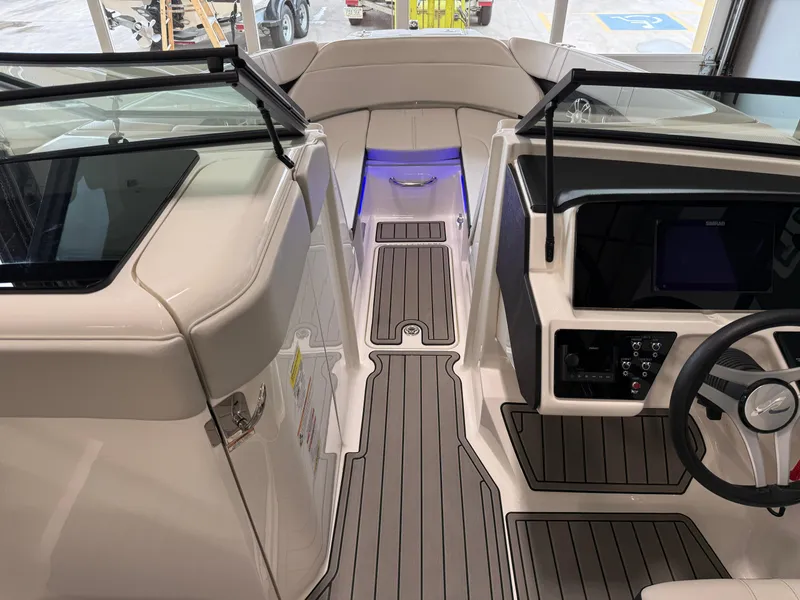 Slide: The Image of 2024 Sea Ray SPX230 boat interior with sleek design and modern dashboard. - 30