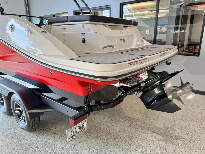 Slide: The Image of 2024 Sea Ray SPX230 boat on trailer, showcasing sleek red and white design. - 5