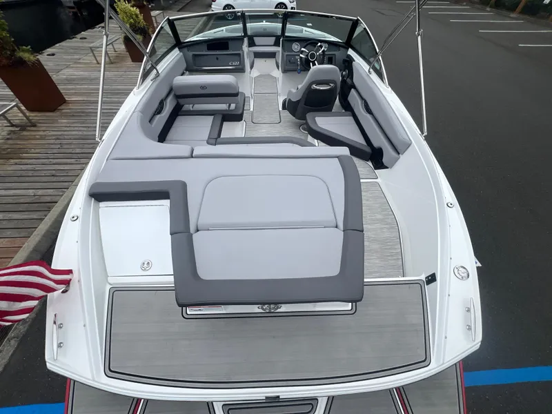 Slide: The Image of 2023 Cobalt CS22 boat interior with sleek seating and modern dashboard design. - 10