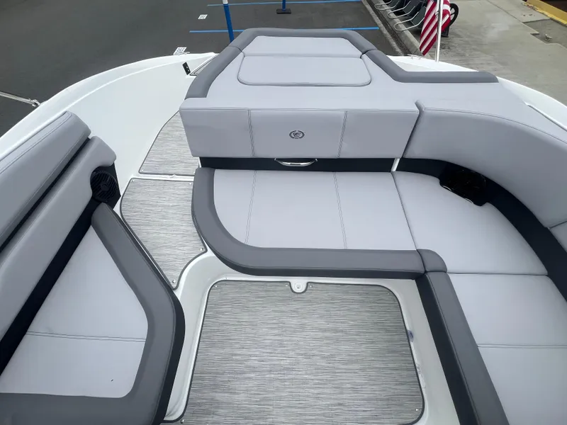 Slide: The Image of 2023 Cobalt CS22 boat interior with gray seating and flooring. - 13