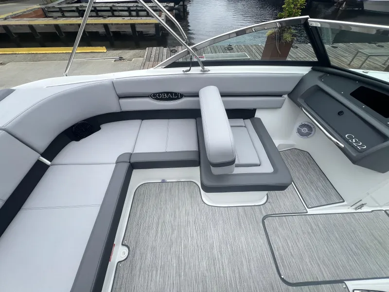 Slide: The Image of 2023 Cobalt CS22 boat interior with gray seating and modern design. - 14
