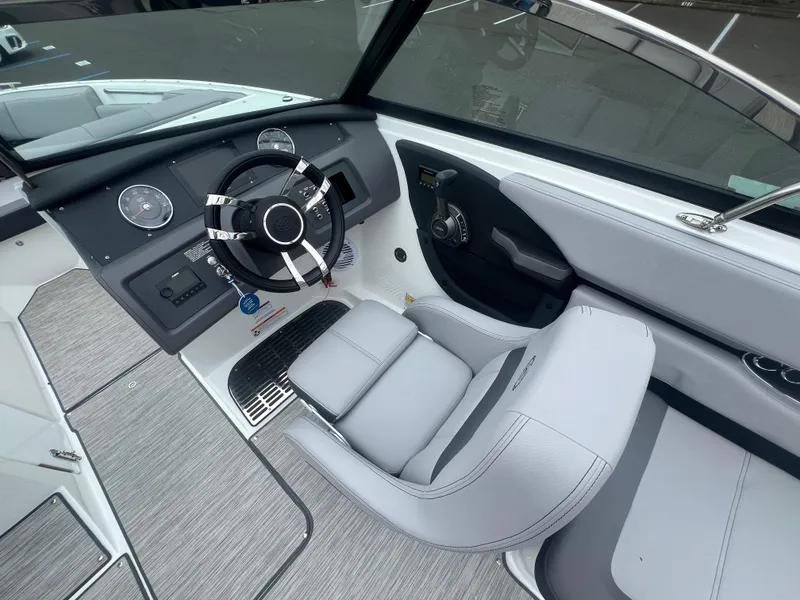 Slide: The Image of 2023 Cobalt CS22 boat interior with modern steering wheel and dashboard controls. - 16