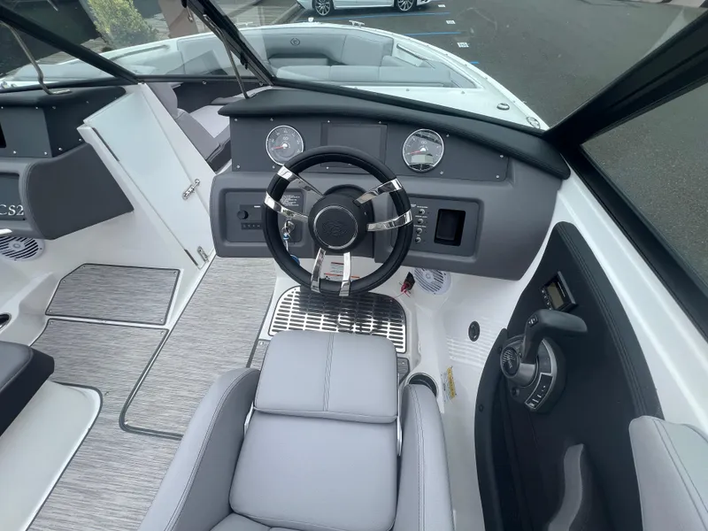 Slide: The Image of 2023 Cobalt CS22 boat interior with modern dashboard and steering wheel. - 17