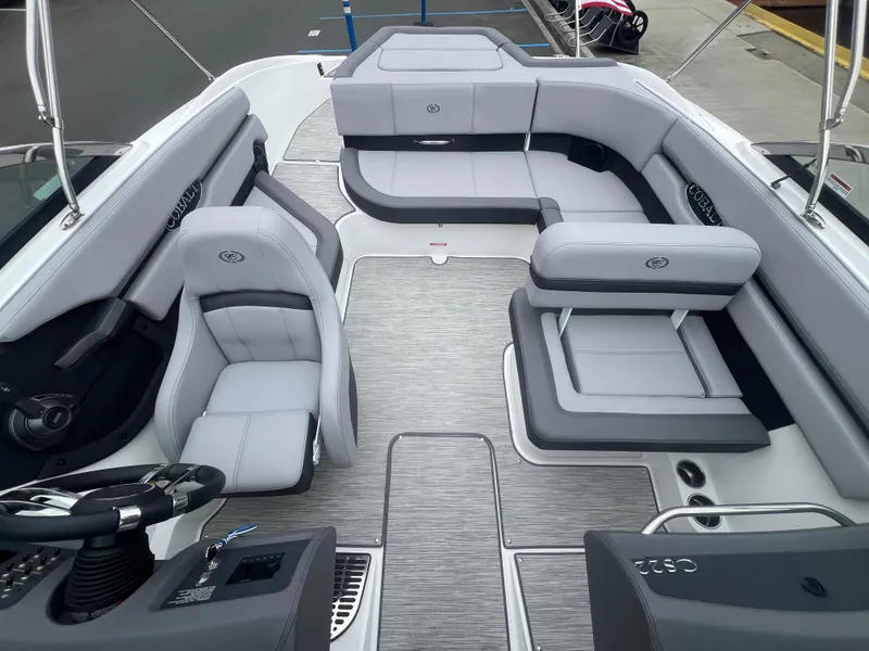 Slide: The Image of 2023 Cobalt CS22 boat interior with sleek gray seating and modern design. - 18