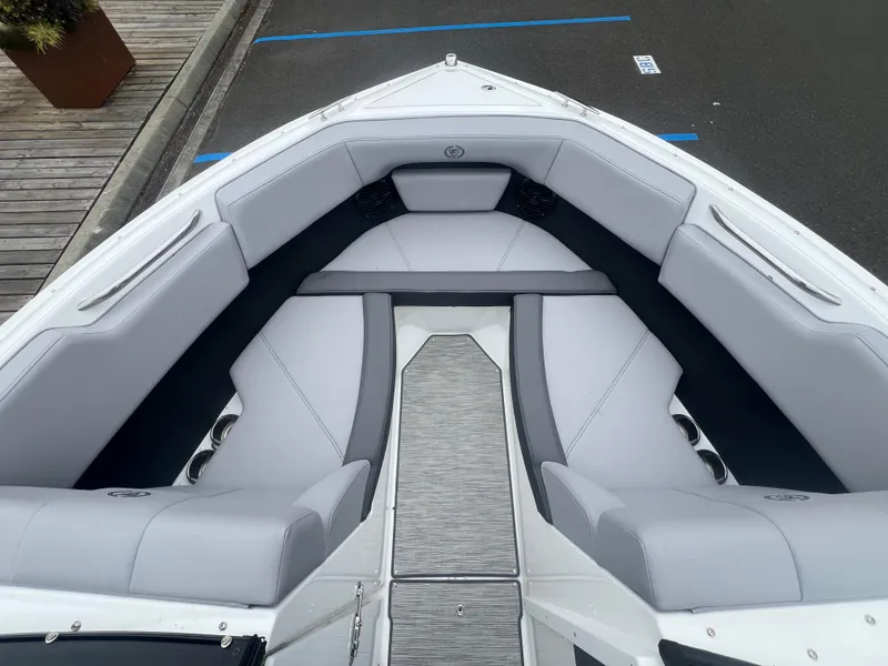 Slide: The Image of 2023 Cobalt CS22 boat interior with gray seating and sleek design. - 19