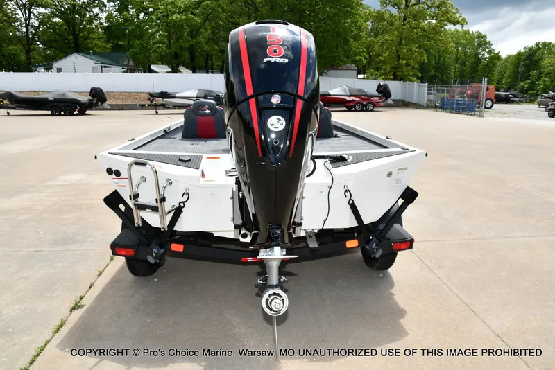 Slide: The Image of 2025 Ranger RT198P Cup Equipped boat with powerful outboard motor, parked outdoors. - 19