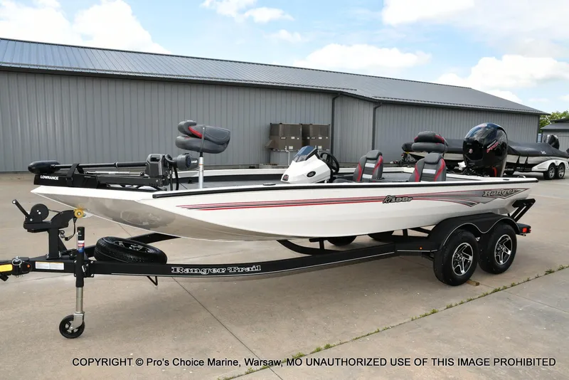 Slide: The Image of 2025 Ranger RT198P Cup Equipped boat on trailer, parked outdoors. - 22