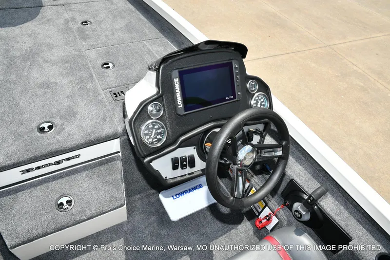 Slide: The Image of 2025 Ranger RT198P Cup Equipped boat dashboard with steering wheel and Lowrance display. - 36