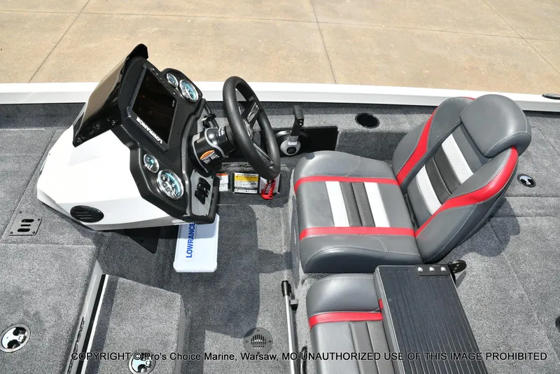 Slide: The Image of 2025 Ranger RT198P Cup Equipped boat interior with steering console and cushioned seat. - 37