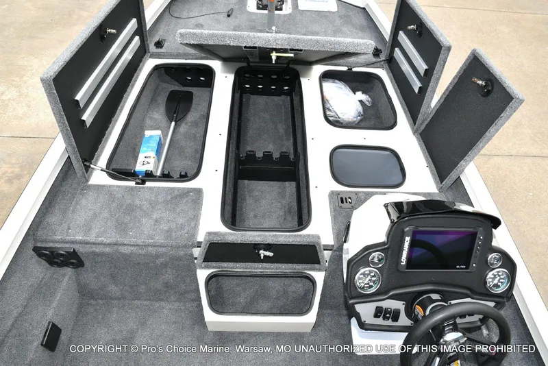 Slide: The Image of 2025 Ranger RT198P Cup Equipped boat interior with storage compartments and control panel. - 41