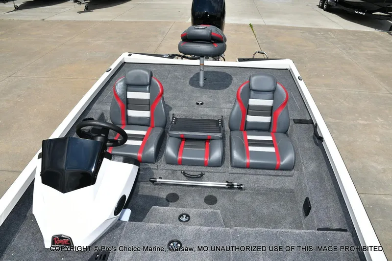 Slide: The Image of 2025 Ranger RT198P Cup Equipped boat interior with gray and red seats, steering console. - 45