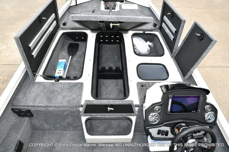 Slide: The Image of 2025 Ranger RT198P Cup Equipped boat interior with storage compartments and control panel. - 8