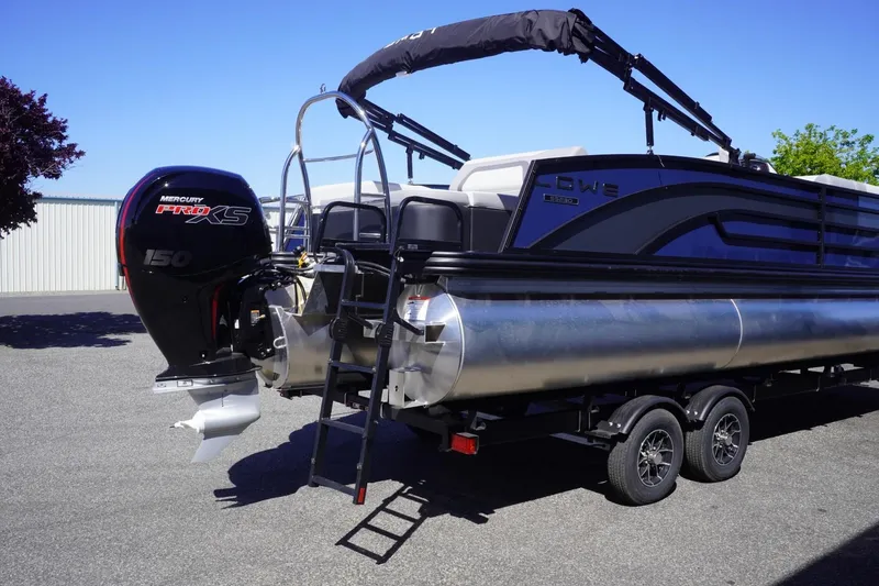 Slide: The Image of 2025 Lowe SS 230 DL pontoon boat with Mercury Pro XS engine on trailer. - 12