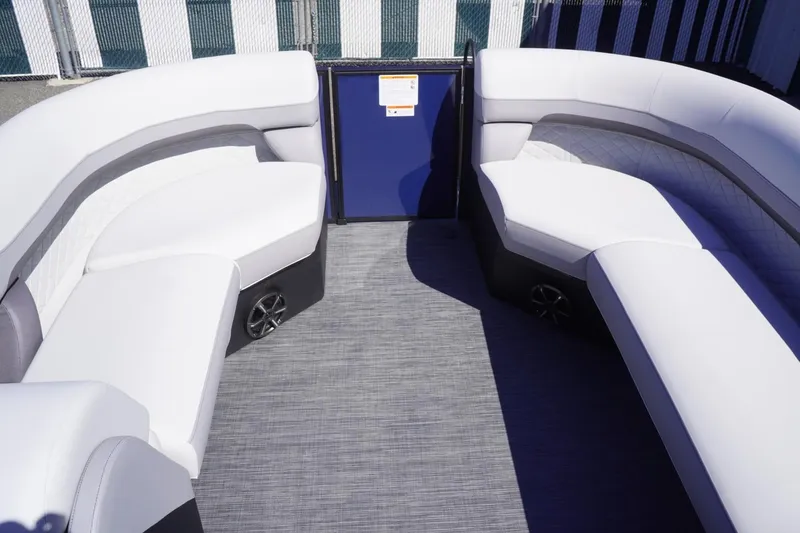 Slide: The Image of 2025 Lowe SS 230 DL boat interior with white seating and gray flooring. - 22