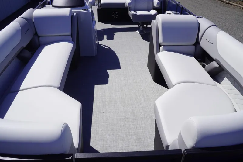 Slide: The Image of 2025 Lowe SS 230 DL pontoon boat interior with spacious seating and modern design. - 28