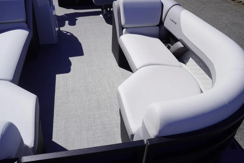 Slide: The Image of 2025 Lowe SS 230 DL pontoon boat with spacious seating and modern design. - 30