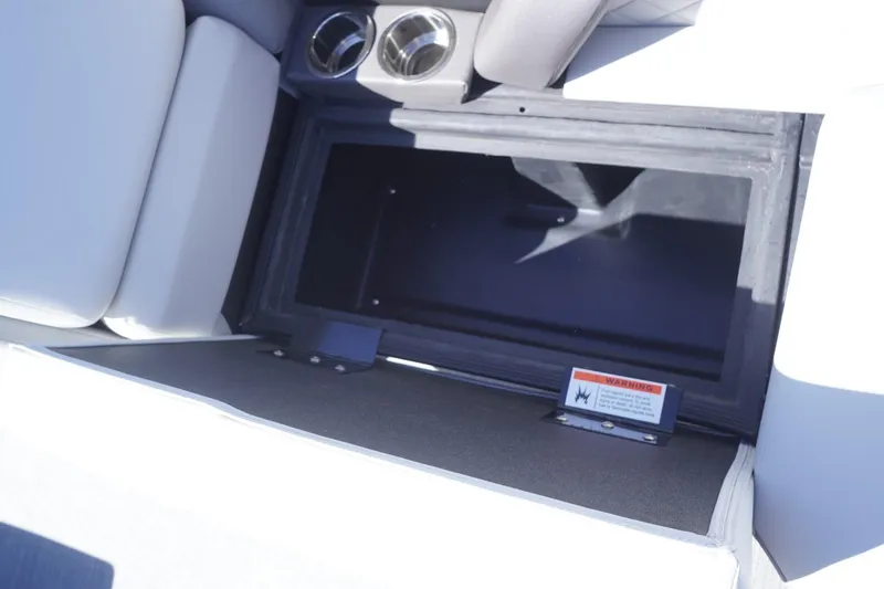 Slide: The Image of Storage compartment in 2025 Lowe SS 230 DL boat with cup holders. - 34