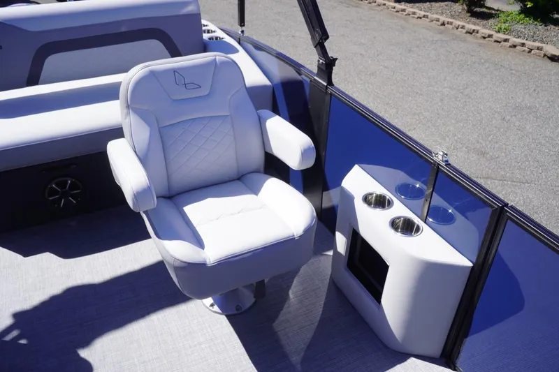 Slide: The Image of Lowe SS 230 DL 2025 boat interior with plush seating and cup holders. - 37