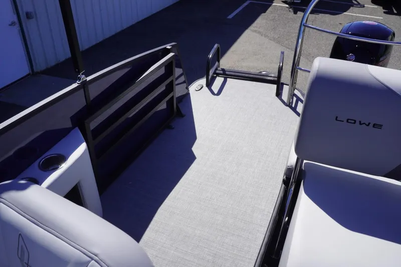 Slide: The Image of 2025 Lowe SS 230 DL boat interior with seating and railing, showcasing modern design. - 39