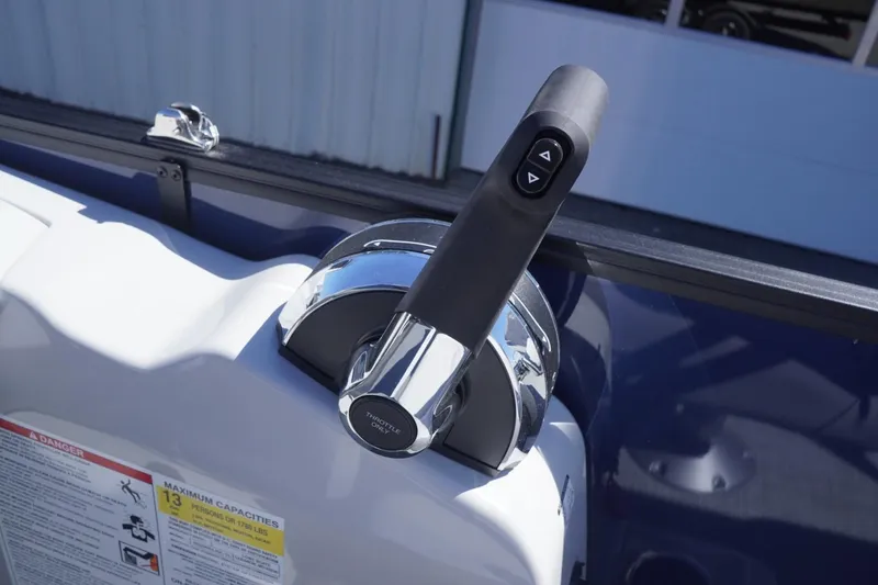 Slide: The Image of Throttle control of 2025 Lowe SS 230 DL boat, featuring sleek design and ergonomic handle. - 42