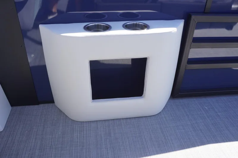 Slide: The Image of Lowe SS 230 DL 2025 boat interior with cup holders and storage compartment. - 45