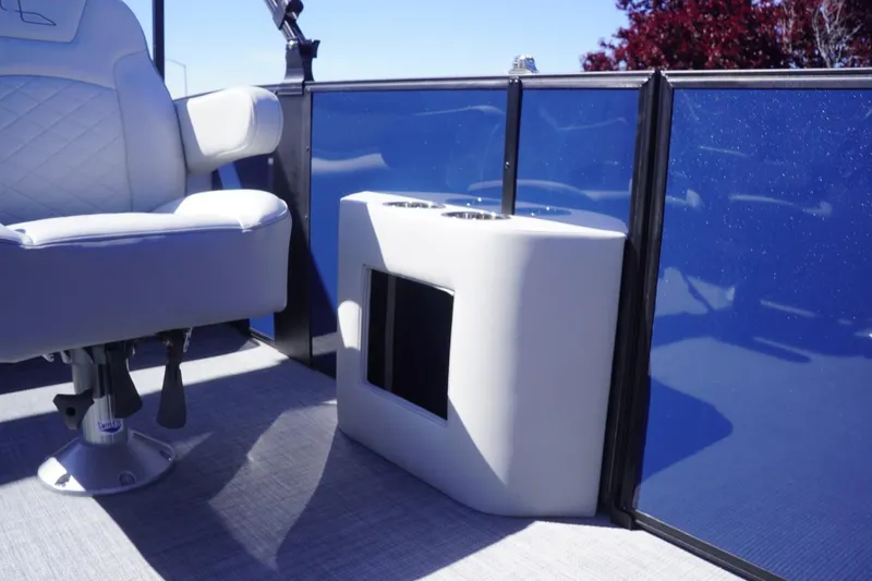 Slide: The Image of 2025 Lowe SS 230 DL boat interior with white seating and blue paneling. - 47
