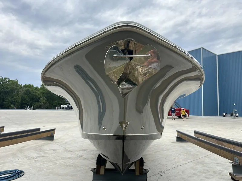 Slide: The Image of 2020 Sea Hunt Gamefish 30 with Coffin Box, docked, showcasing sleek hull design. - 10