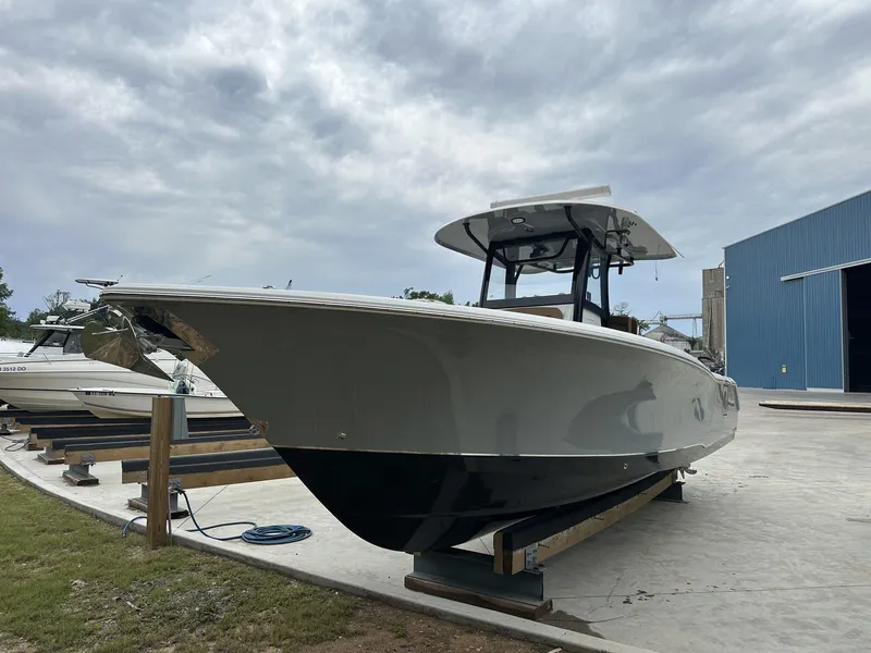Slide: The Image of 2020 Sea Hunt Gamefish 30 with Coffin Box on display outdoors. - 11