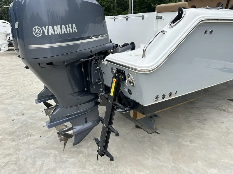 Slide: The Image of 2020 Sea Hunt Gamefish 30 with Yamaha outboard motor, displayed on a concrete surface. - 14