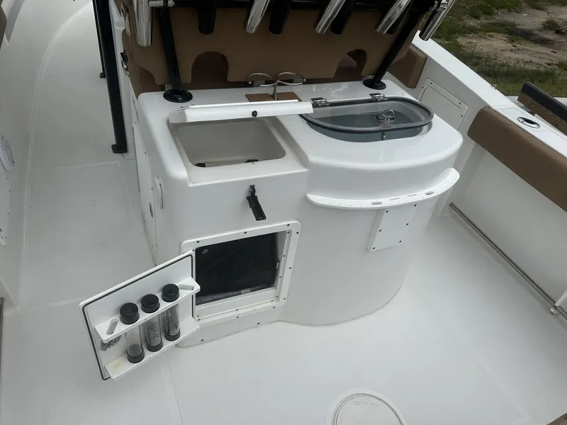Slide: The Image of 2020 Sea Hunt Gamefish 30 boat interior with storage and sink. - 17