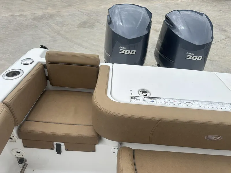 Slide: The Image of 2020 Sea Hunt Gamefish 30 boat with twin Yamaha 300 engines and tan seating. - 20