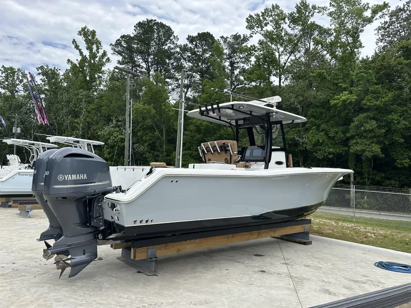 Slide: The Image of 2020 Sea Hunt Gamefish 30 with Coffin Box, featuring Yamaha outboard, docked outdoors. - 3