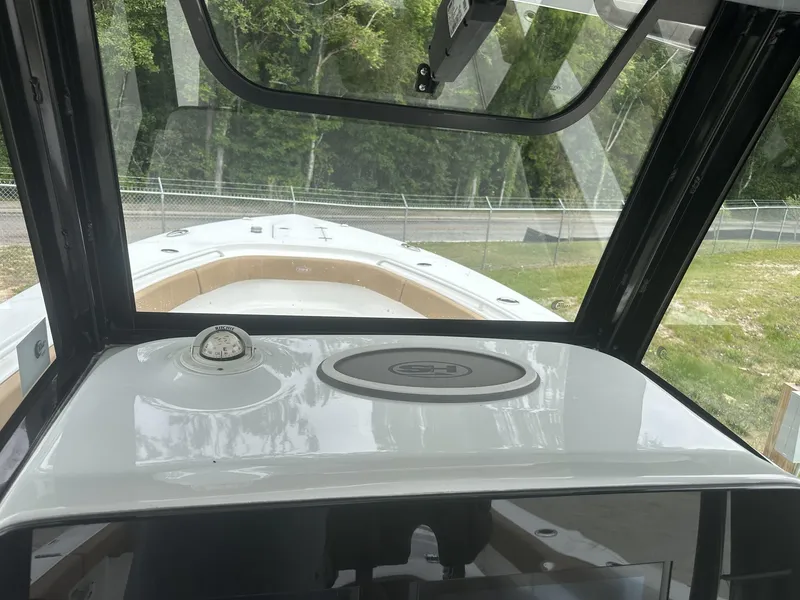 Slide: The Image of 2020 Sea Hunt Gamefish 30 interior view with compass and windshield. - 30