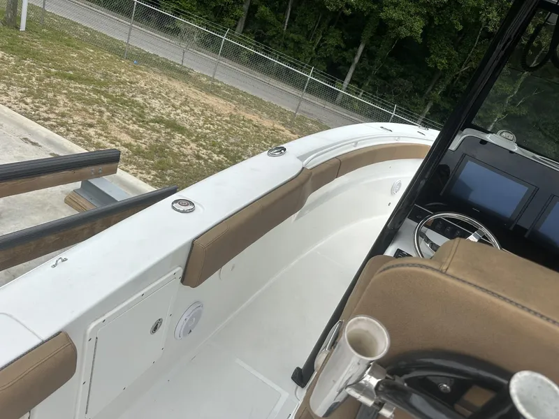 Slide: The Image of 2020 Sea Hunt Gamefish 30 boat interior with steering console and seating. - 38