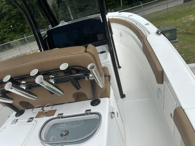 Slide: The Image of 2020 Sea Hunt Gamefish 30 boat interior with rod holders and seating. - 39