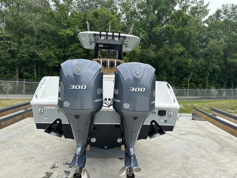 Slide: The Image of 2020 Sea Hunt Gamefish 30 with twin Yamaha 300 engines, parked outdoors. - 5