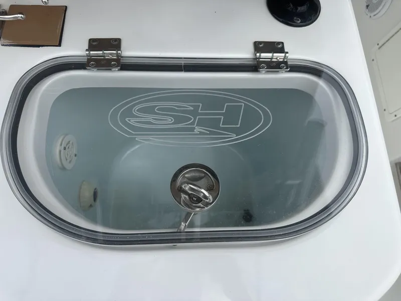Slide: The Image of 2020 Sea Hunt Gamefish 30 livewell with transparent lid and SH logo. - 18