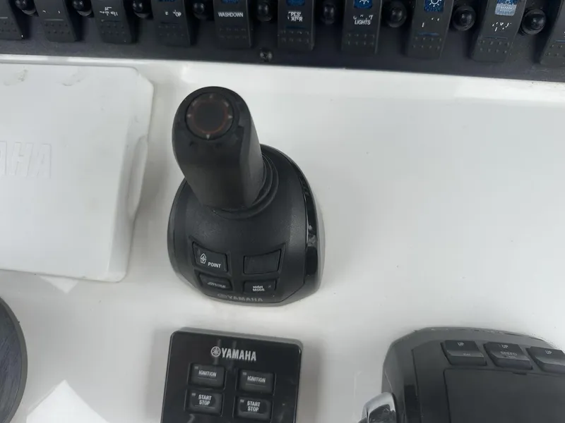 Slide: The Image of 2020 Sea Hunt Gamefish 30 control panel with Yamaha joystick and switches. - 23