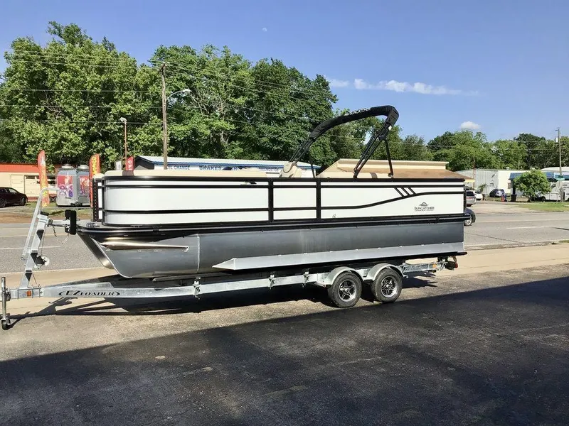 Slide: The Image of 2025 G3 Select 322RF pontoon boat on trailer, parked outdoors. - 12