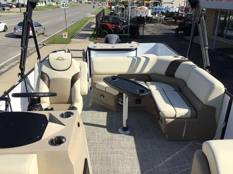 Slide: The Image of 2025 G3 Select 322RF boat interior with plush seating and steering console. - 18