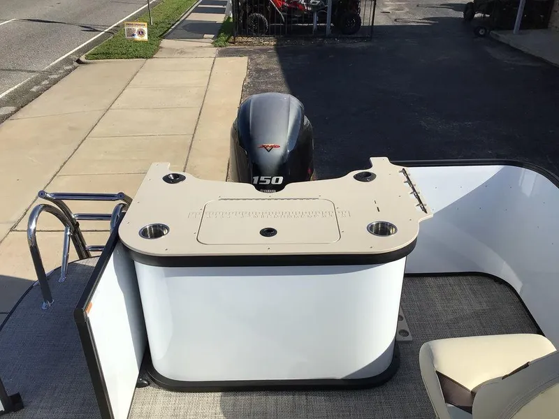 Slide: The Image of 2025 G3 Select 322RF boat with outboard motor and seating area, viewed from above. - 24