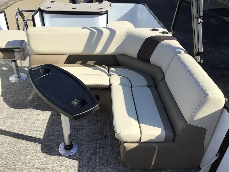 Slide: The Image of Luxurious seating area on 2025 G3 Select 322RF boat with cupholders and table. - 27